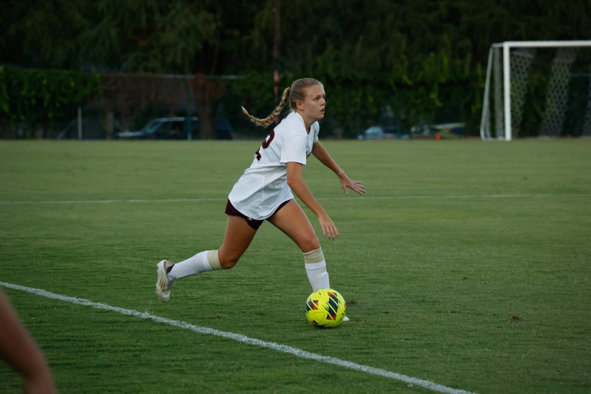 Texas State sophomore midfielder Kaylie Smith (22) dribbles the ball down the sideline during the match against Marshall, Thursday, Sept. 26, 2024, at Bobcat Soccer Complex.