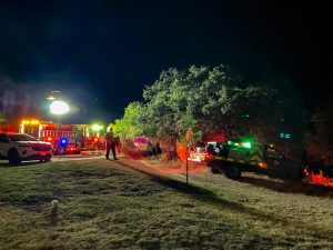 A brush fire vehicle travels off road to fight a brush fire in the Spring Lake Natural Area on Saturday, Oct. 12, 2024, bordering the Cottages at Hillside Ranch.