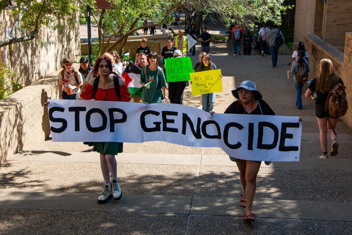 The Palestine Solidarity Committee at Texas State marched from the Stallions to the LBJ Student Center to protest the Democratic Our Fight, Out Future Rally on Tuesday, Oct. 1, 2024, on campus. About a dozen and supporters members of the committee waved flags and cheered for Palestine.