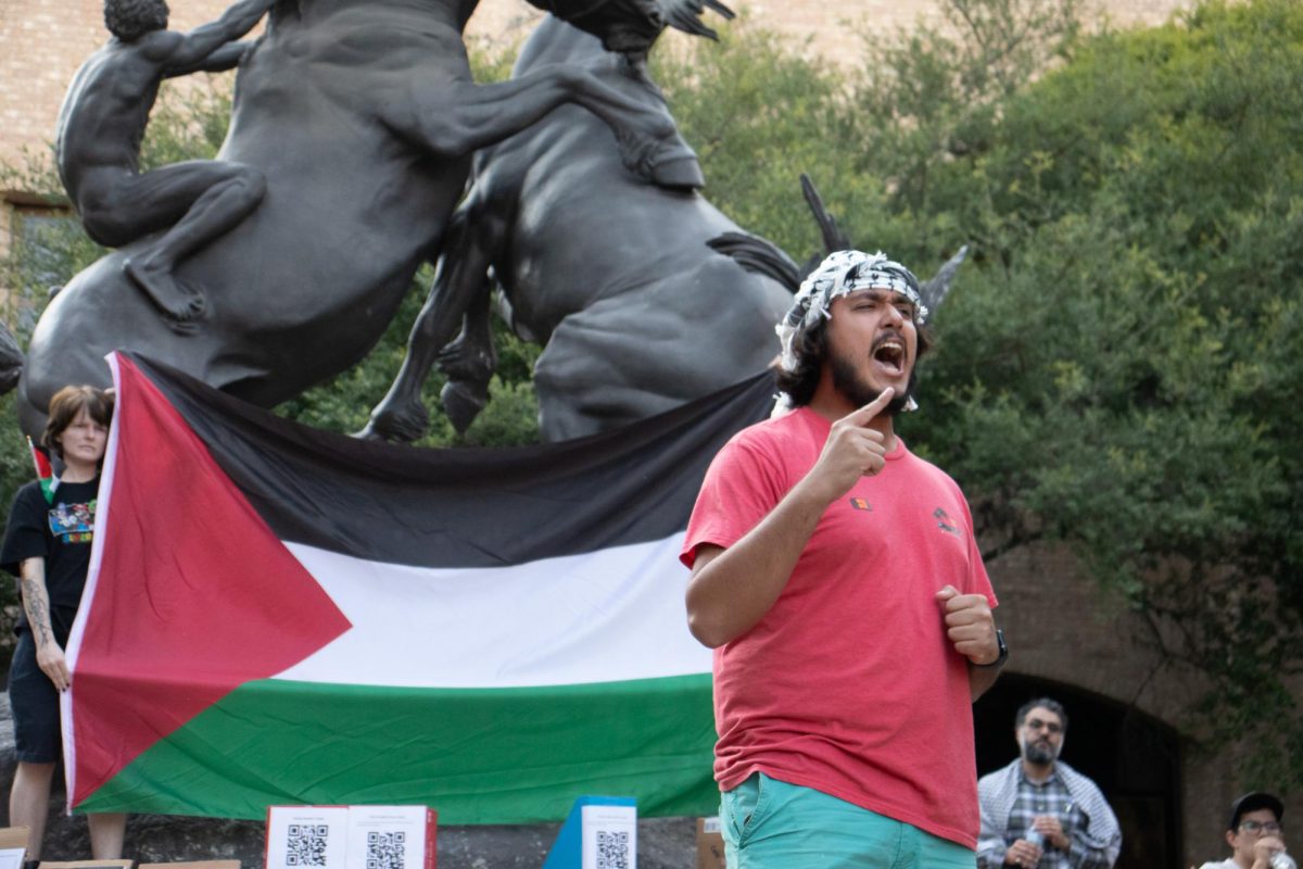 Applied sociology sophomore Daniel Gamez Gomez leads a chant at the Palestine Solidarity Committee's vigil for Lebanon, Tuesday, Oct. 8, 2024, at the Fighting Stallions Statue.