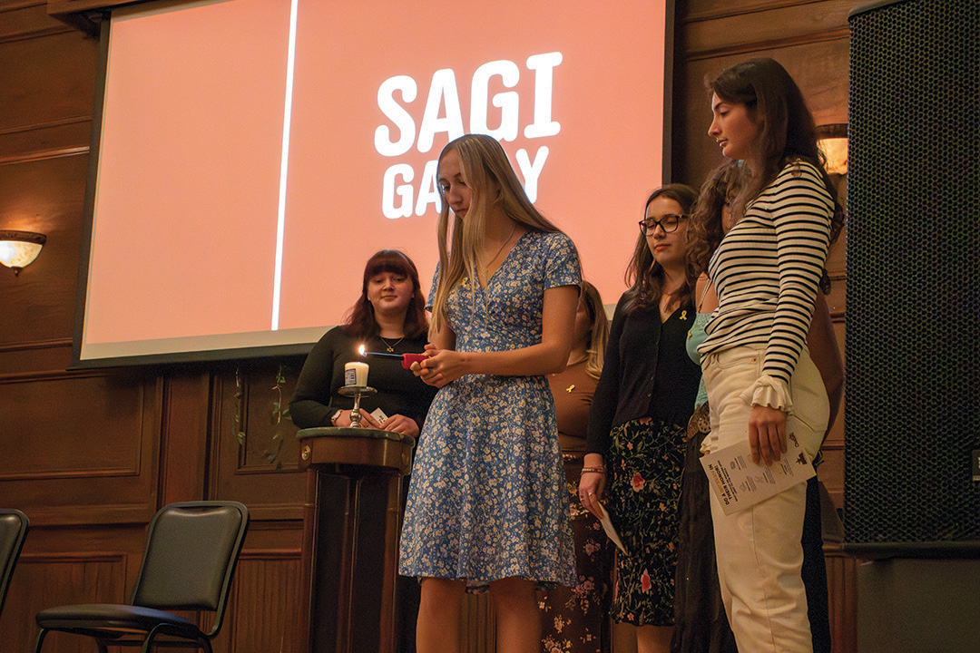 The student council for Jewish Bobcats light a candle for the victims of the October 7th massacre at the memorial held by Chabad at Texas State University, Chabad San Marcos and Faces of October Seventh, Monday Oct. 14, at the Price Center and Garden.