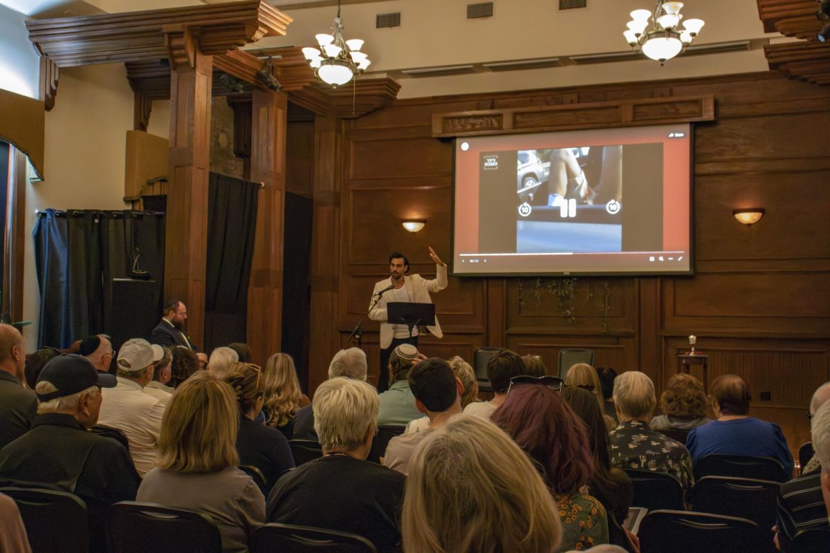 Sagi Gabay survivor of the Hamas attack on the Nova Music Festival shows graphic images of the attack at the October 7th memorial held by Chabad Texas State University, Chabad San Marcos and Faces of October Seventh, Monday, Oct. 14, 2024, at the Price Center and Garden.