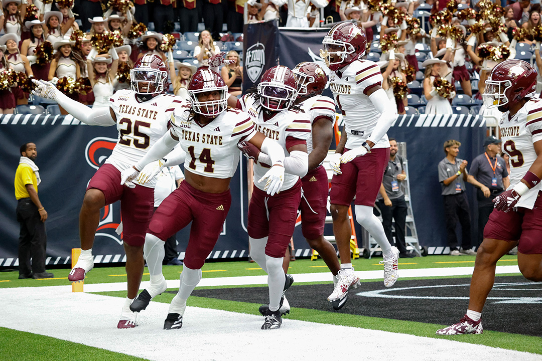 Texas State freshman wide receiver Jordan Martin (14) and his teammates celebrate his touchdown during the game against Sam Houston State, Saturday, Sept. 28, 2024, at NRG Stadium in Houston.