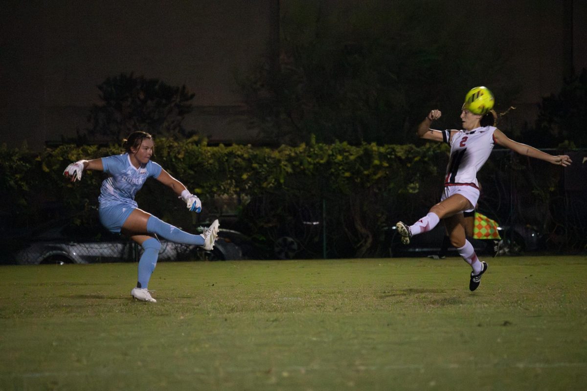 Texas State senior goalkeeper Katelyn Chrisman (blue) kicks the ball away from the goal during the match against Marshall, Thursday, Sept. 26, 2024, at Bobcat Soccer Complex.