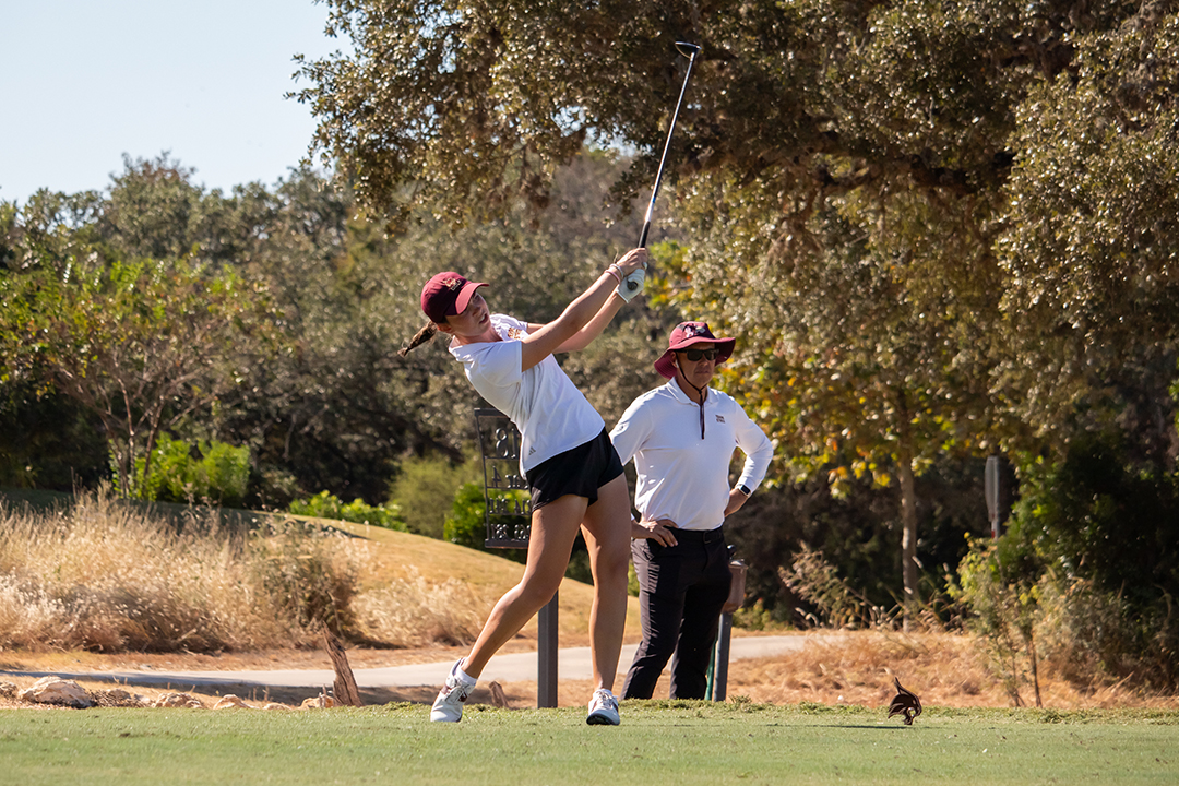 Texas State freshman Allie Justiz drives the ball at hole 18 during the Jim West Challenge at the Kissing Tree Golf Club in San Marcos, Sunday, Oct. 20, 2024.