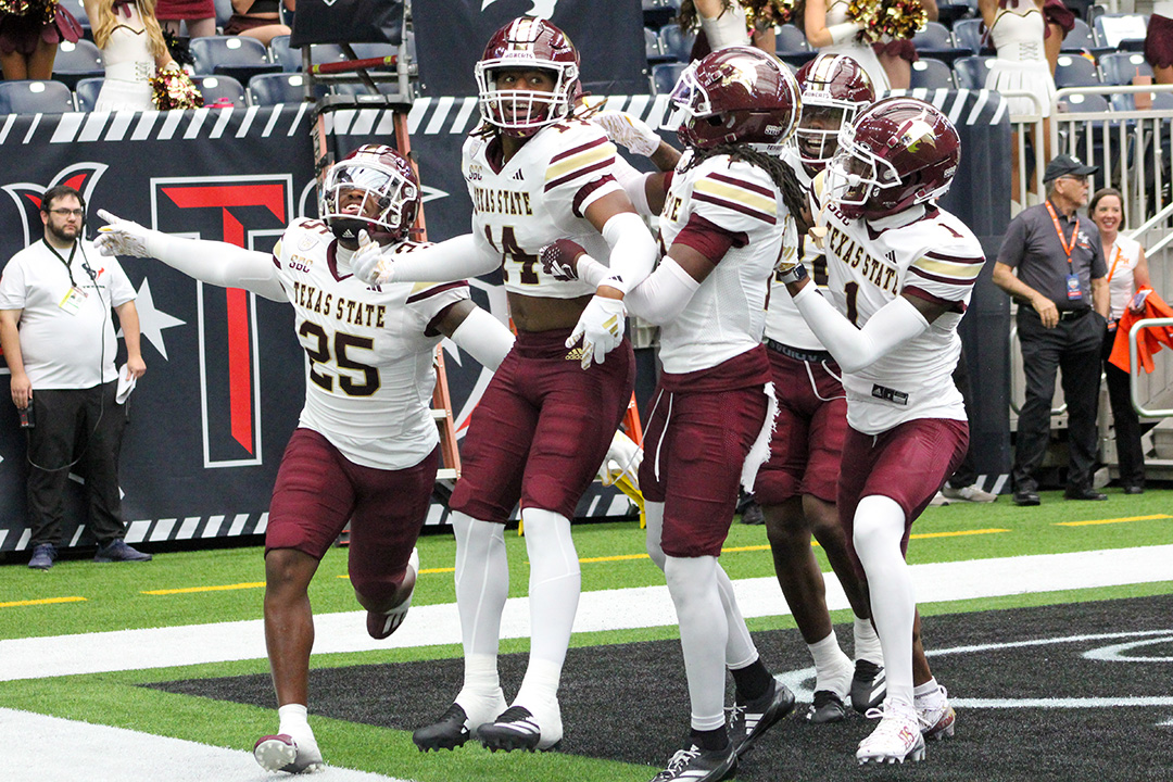 Texas State freshman wide receiver Jordan Martin (14) and his teammates celebrate his touchdown during the game against Sam Houston State, Saturday, Sept. 28, 2024, at NRG Stadium in Houston.