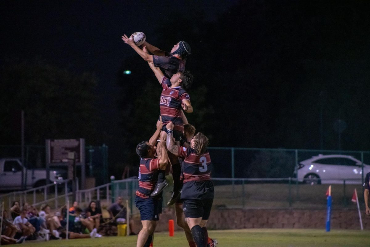 Texas State rugby players pile up during a line-out in a match against UTSA, Friday, Sept. 27, 2024, at the West Campus Fields in San Marcos. 