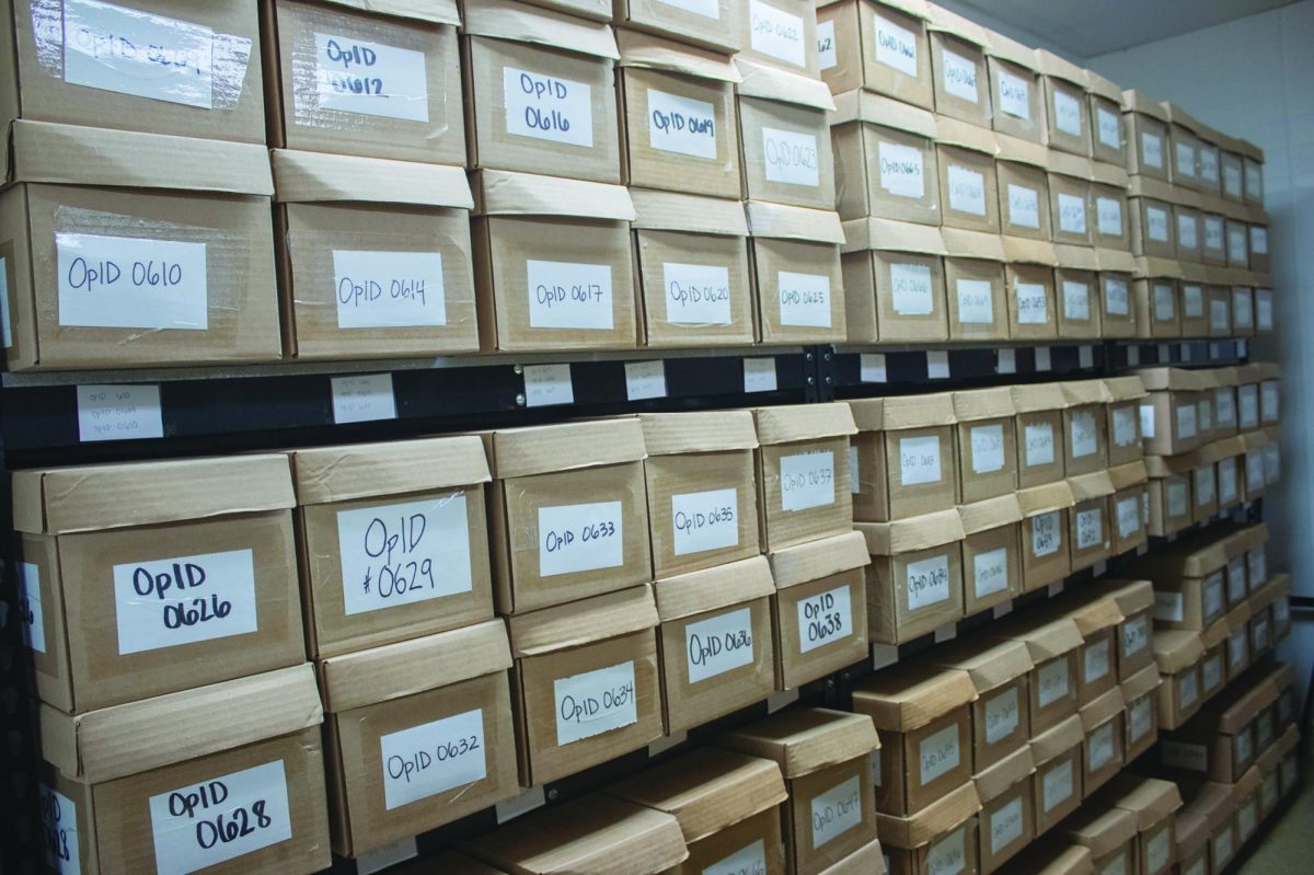 Boxes containing the remains of unidentified individuals stored in the Operation Identification forensics room, Tuesday, Oct. 22, 2024, at the Freeman Center research facility.  Every unidentified body is attached to their OpID, a number to help with identifying and organized storing of their remains; the forensics room houses over 300 boxes of remains and is quickly running out of storage space.