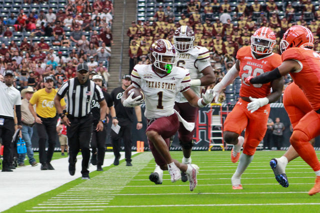 Texas State sophomore wide receiver Chris Dawn Jr. (1) runs with the ball down the sideline during the game against Sam Houston State, Saturday, Sept. 28, 2024, at NRG Stadium in Houston. 