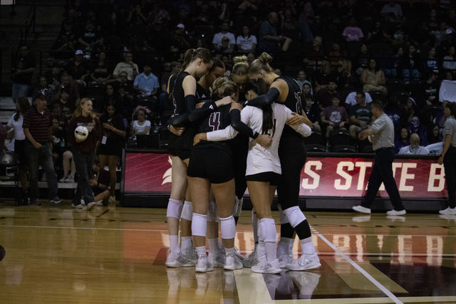 The Texas State volleyball team huddles together during the game against Louisiana-Lafayette, Friday, Oct. 4, 2024, at Strahan Arena.  