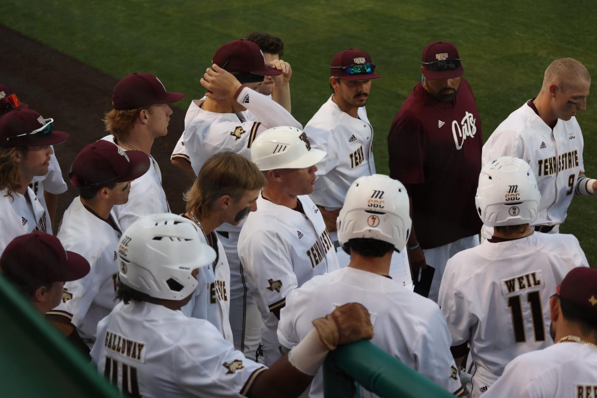 Members of the Texas State baseball team gather in the dugout in-between innings during the game against Louisiana-Lafayette, Friday, March 29, 2024, at Bobcat Ballpark.