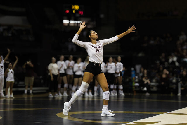 Texas State fifth year setter Ryann Torres (14) prepares to serve the ball during the match against James Madison, Friday, Nov. 15, 2024, at Strahan Arena.