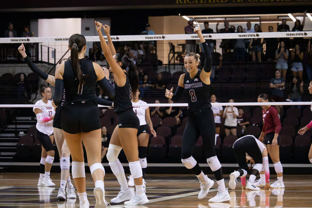 Texas State redshirt sophomore outside hitter Samantha Wunsch (8) celebrates a successful set against Troy, Friday, Oct. 4, 2024, at Strahan Arena.