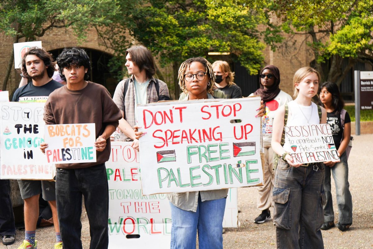 A student holds a sign supporting Palestinian freedom, Wednesday, Nov. 13, 2024, at the Stallions. 