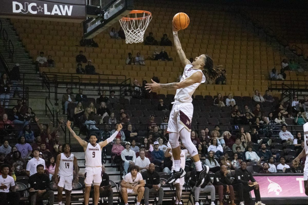 Texas State junior guard Kaden Gumbs (11) makes a layup against McMurry. Friday, Nov. 8, 2024 at Strahan Arena.