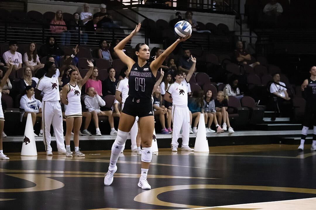 Texas State fifth year setter Ryann Torres (14) prepares to serve the ball during the match against Arkansas State, Friday, Oct. 18, 2024,
at Strahan Arena.