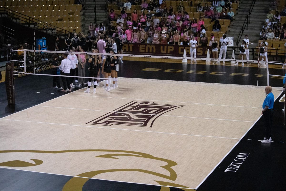 The Texas State volleyball team huddles together between sets during the game against Arkansas State, Saturday, Oct. 19, 2024, at Strahan Arena. 