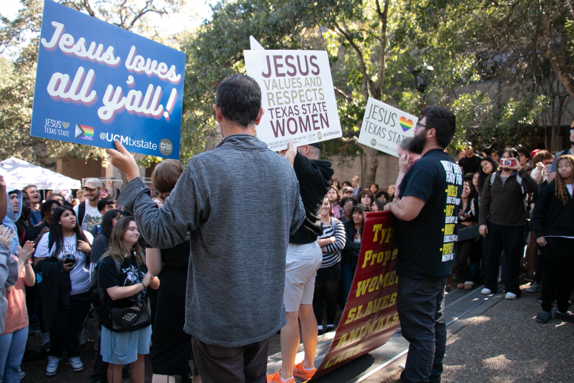 (Photo Gallery) - Demonstrators spark counter-protest of hundreds at TXST