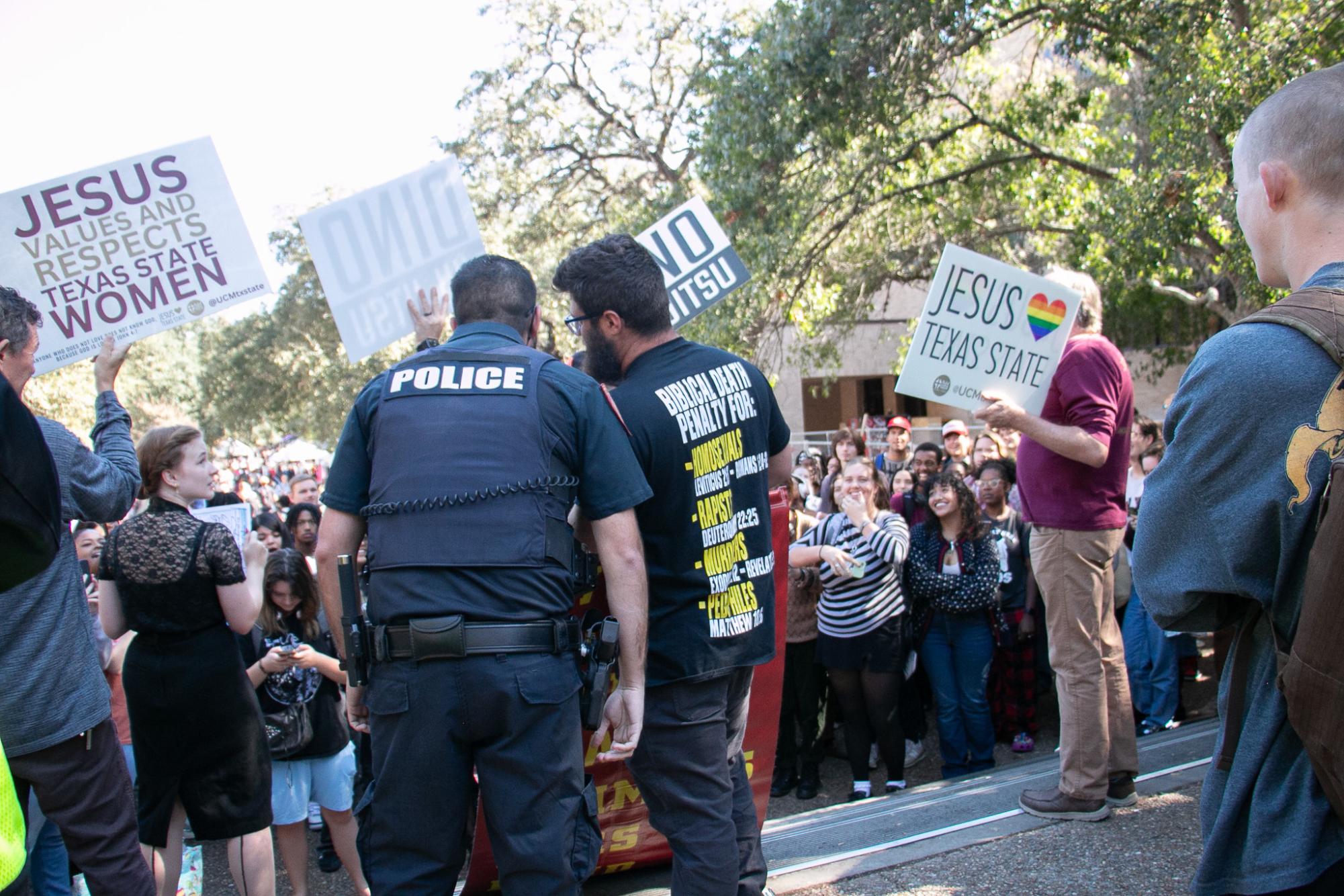 (Photo Gallery) - Demonstrators spark counter-protest of hundreds at TXST