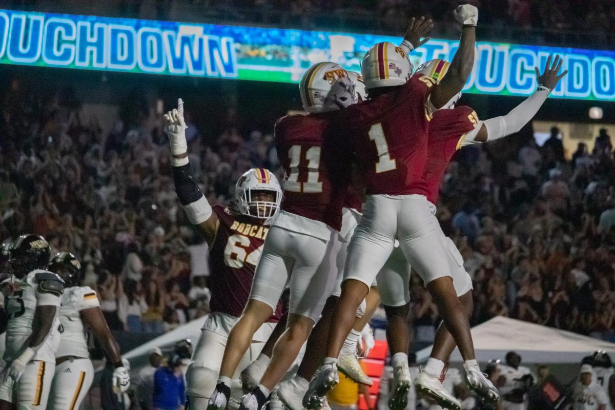 Members of Texas State's offense celebrates senior wide receiver Jaden Williams (0) scoring a touchdown against Southern Miss. Saturday, Nov. 17, 2024, at UFCU Stadium.