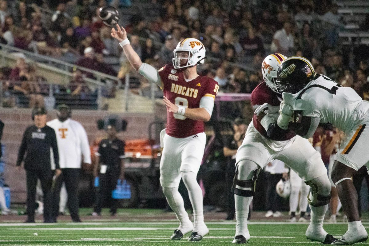 Texas State freshman quarterback Brad Jackson (8) throws a pass versus the Southern Miss defense, Saturday, Nov. 16, 2024, at UFCU Stadium.