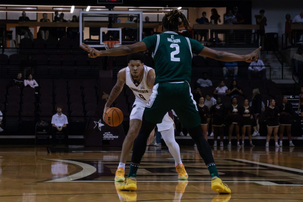 Texas State redshirt senior forward Tylan Pope (9) attempts stares down his Eastern Michigan defender. Monday, Nov. 11, 2024 at Strahan Arena.