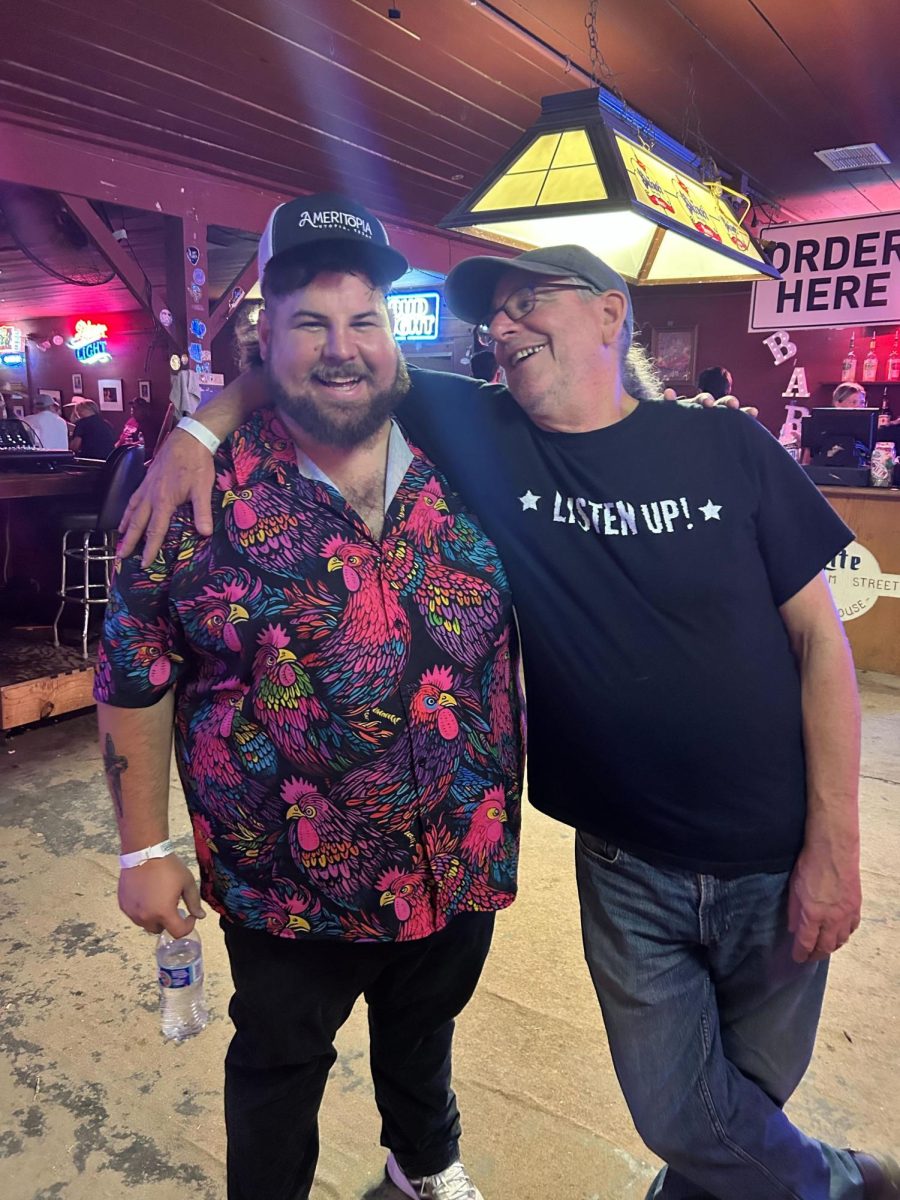 Musician Missoula Slim (Right) poses for a photo with Ty (Left) after Ty's performance during Cheatham Street Warehouse's 50th Anniversary Street Party, Sunday, Oct. 20, 2024, at Cheatham Street Warehouse.