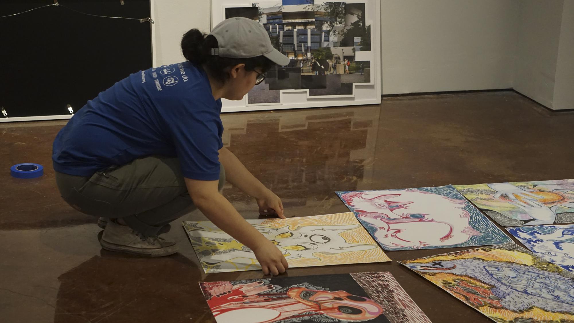 Studio art senior Katie Denson installs work for the “When All Is Said And Done” senior student thesis exhibition, Sunday, Dec. 1, 2024, at the JCM Flex Gallery.