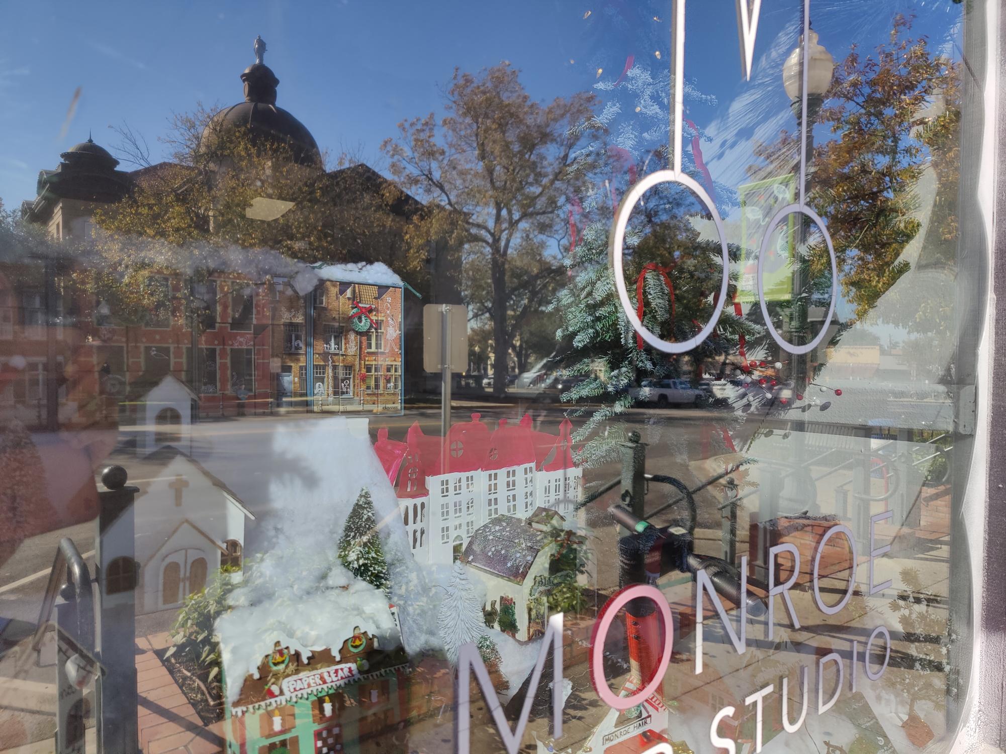 Monroe Hair Studio's storefront decorated for Merry on the Squarey's Window Decoration Contest, Monday, Dec. 9, 2024, at The Square.