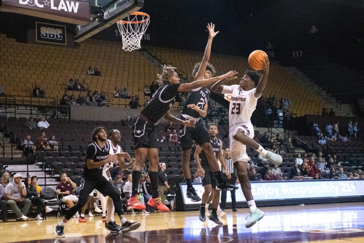 Texas State senior guard Joshua O'Garro (23) makes a layup against McMurry. Friday, Nov. 8, 2024 at Strahan Arena.