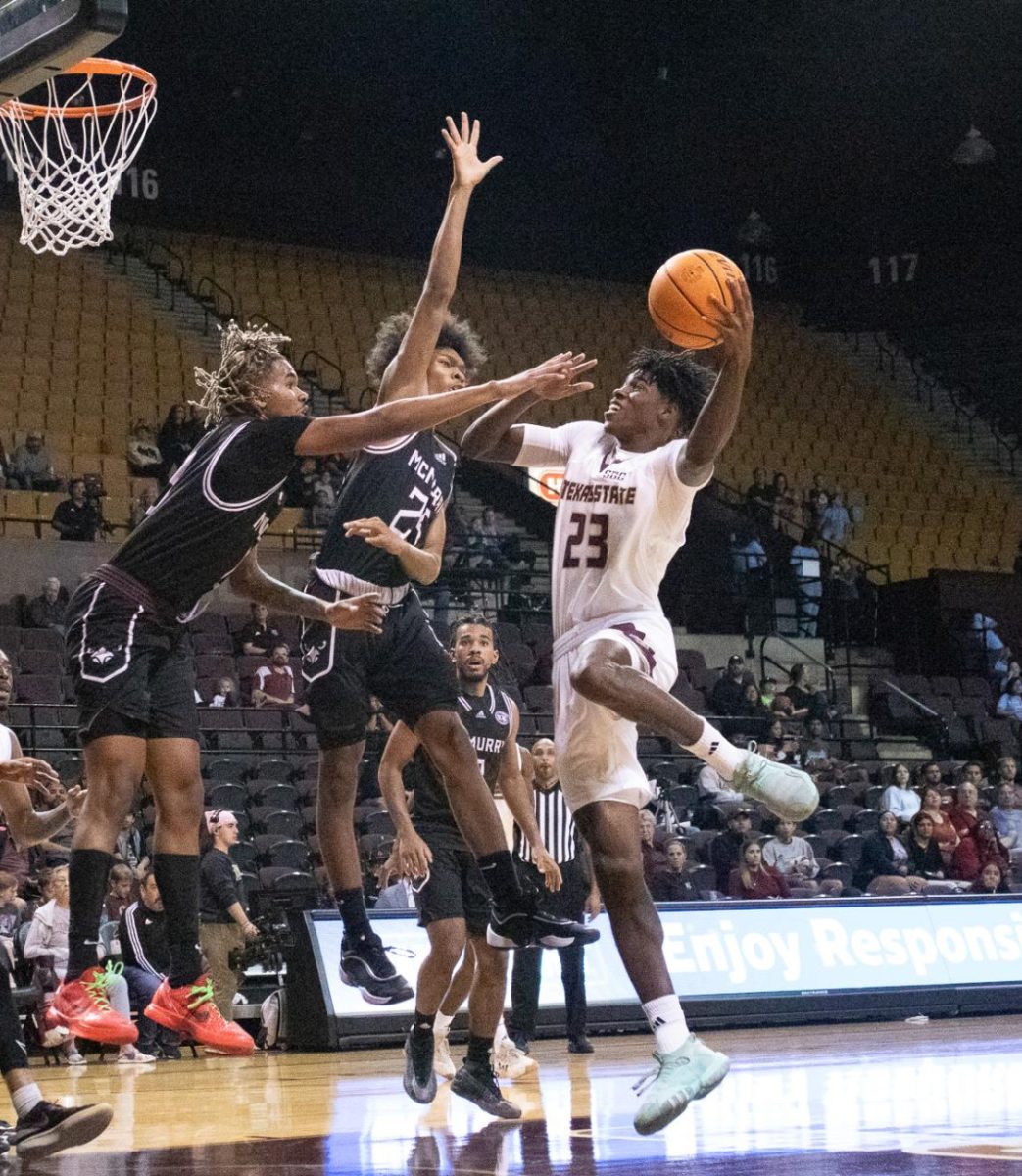 Texas State senior guard Joshua O'Garro (23) makes a layup against McMurry. Friday, Nov. 8, 2024 at Strahan Arena.