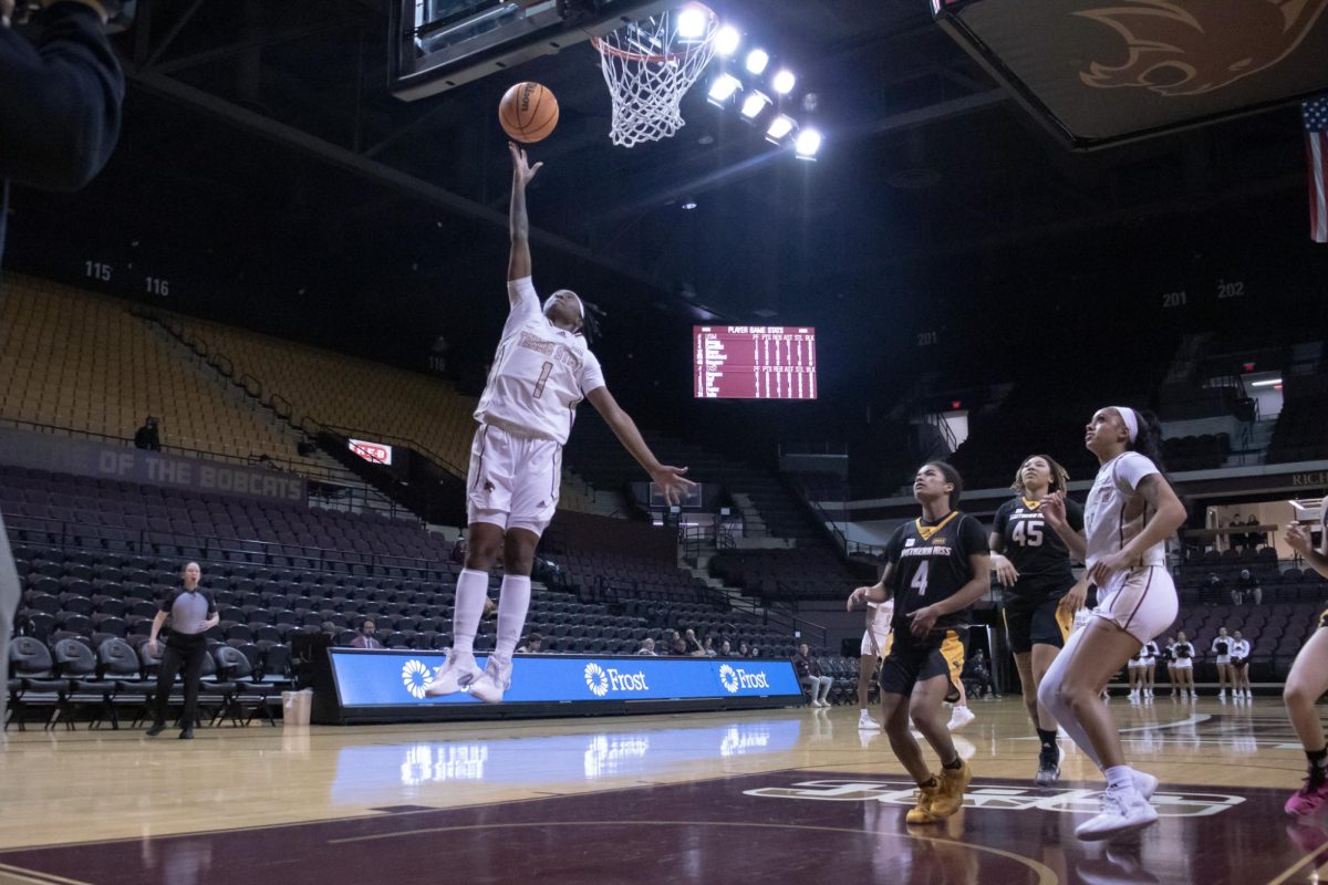 Texas State graduate student guard Ja'Niah Henson (1) jumps up to make a layup, Wednesday, Feb. 28, 2024 at Strahan Arena. Bobcats lost 67-59.