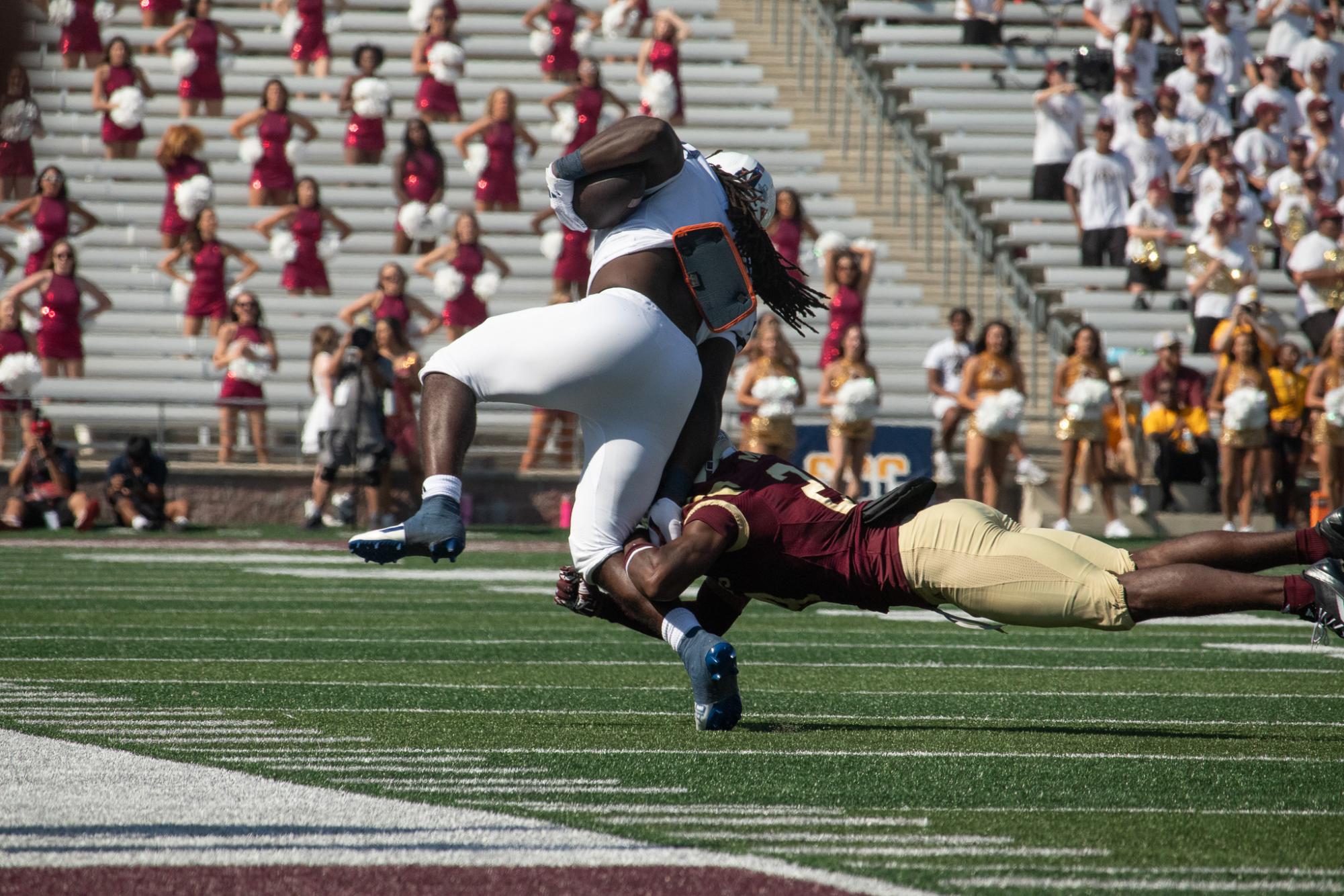 Texas State junior Linebacker Max Harris (2) tackles a player for UTSA that is carrying the ball. Saturday, Sept. 7, 2024 at UFCU Stadium.