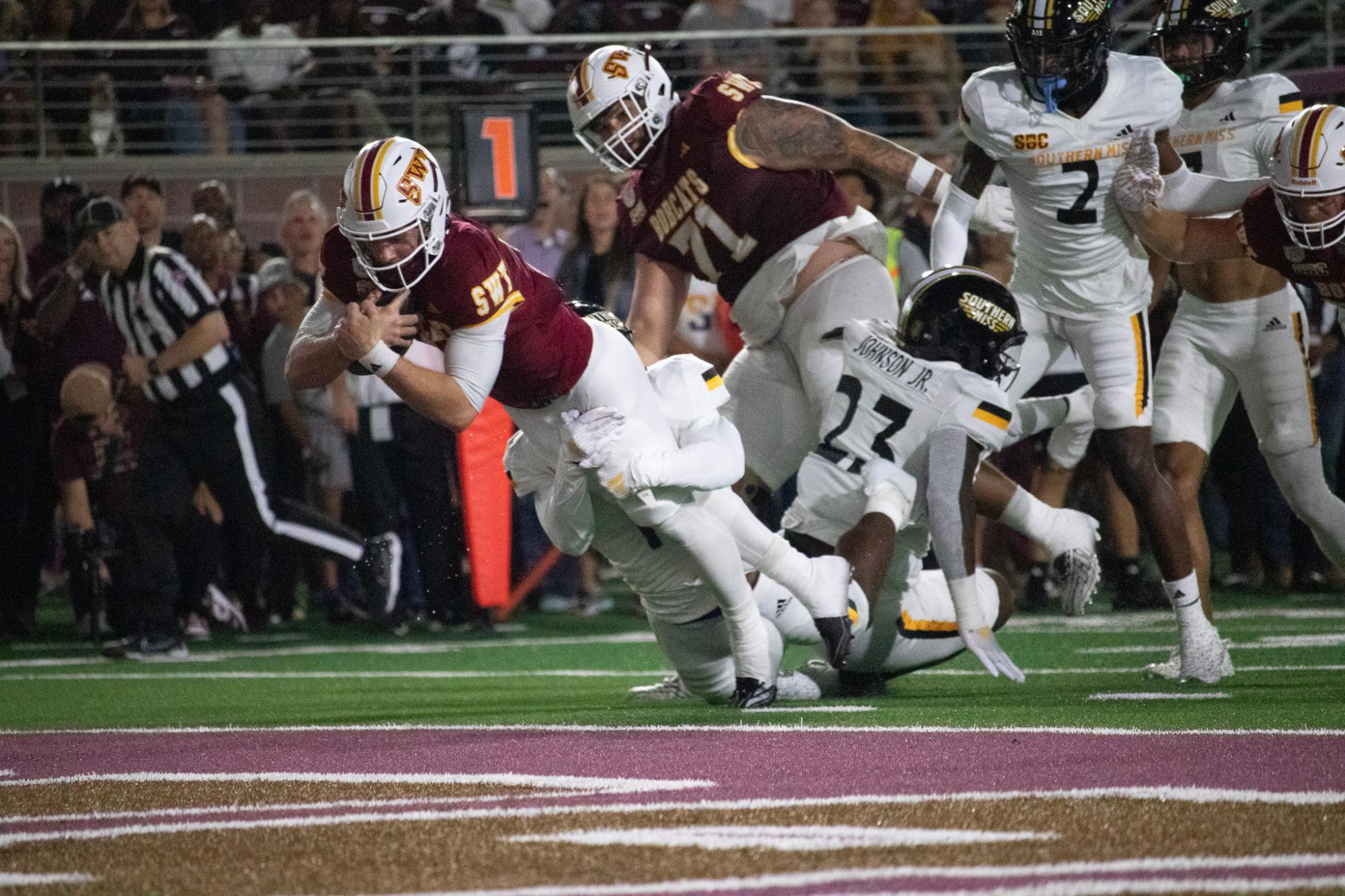 Texas State redshirt junior wide receiver Drew Donley (18) pushers past the Golden Eagles defense to score a touchdown. Saturday, Nov. 17, 2024 at UFCU Stadium.