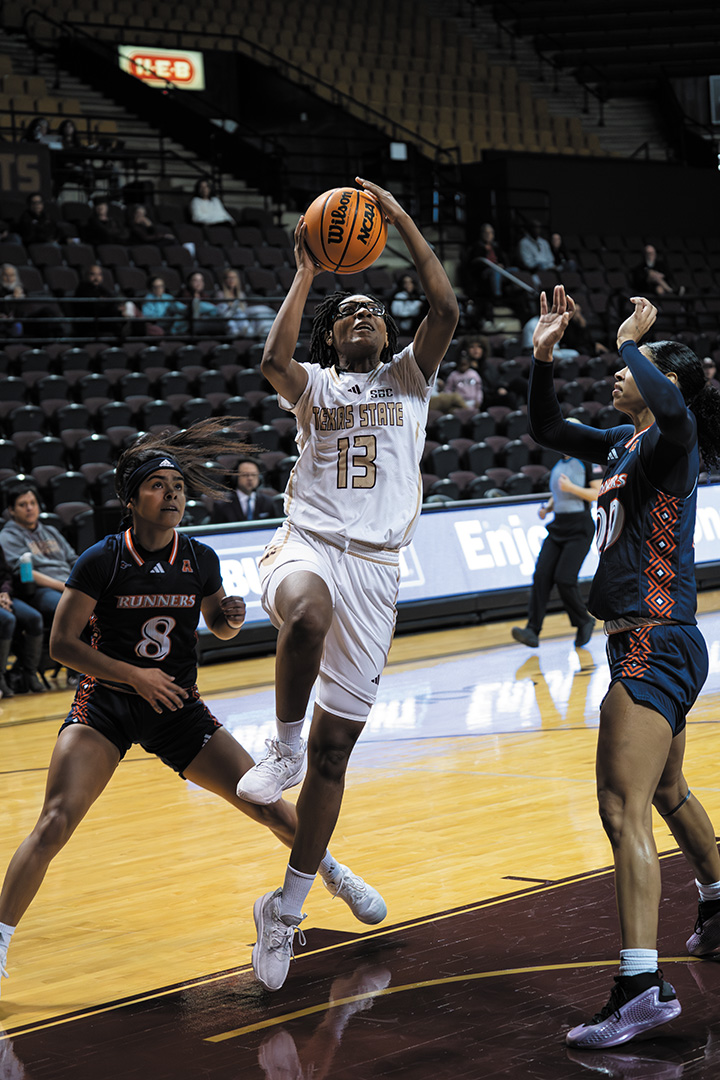 Texas State sophomore guard Taleiyah Gibbs (13) drives the ball to the basket during the game against UTSA, Saturday, Dec. 21, 2024 at Strahan Arena.