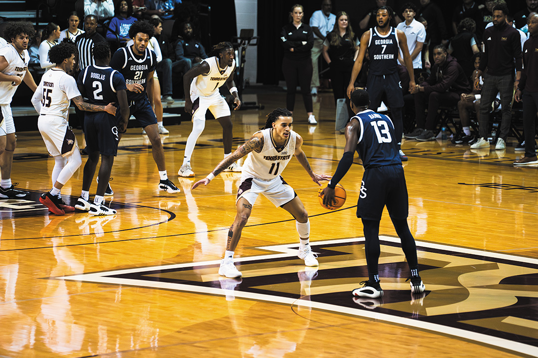 Texas State point guard sophomore Kaden Gumbs (11) plays defense against Georgia Southern, Saturday, Dec. 21, 2024 at Strahan Arena.