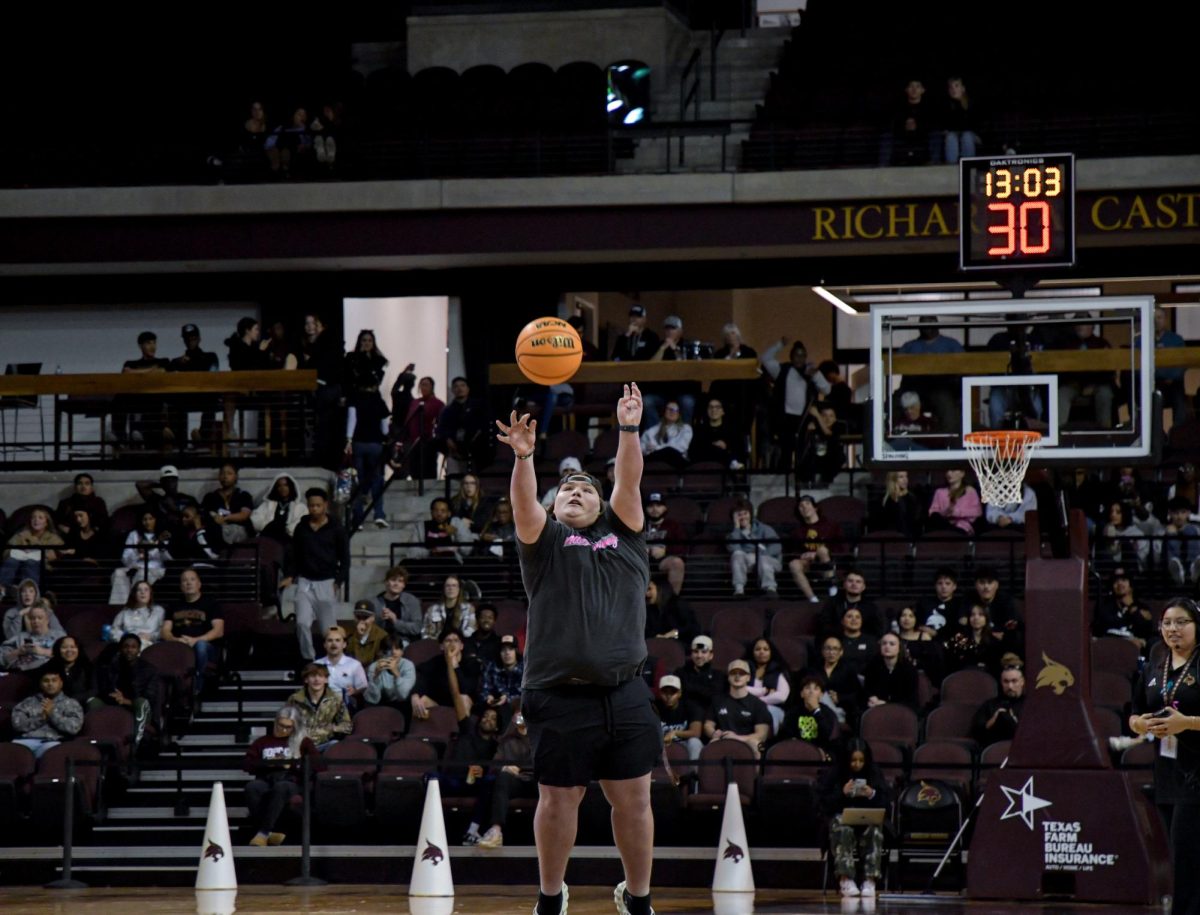 A Texas State students attempts the half court shot for free tuition during the Texas State vs. Georgia State basketball game on Wednesday, Jan. 15, 2025, at Strahan Arena.