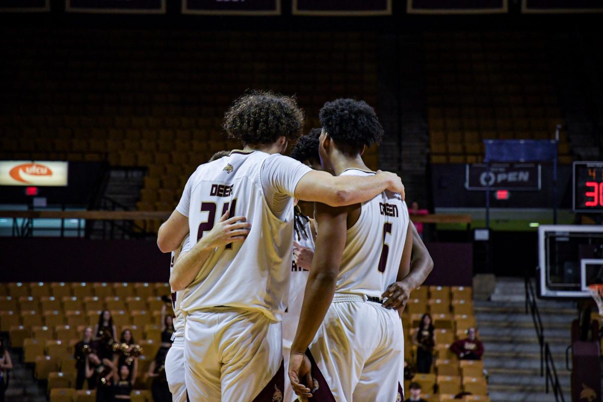 The Texas State men's basketball team huddles during the Texas State vs. Georgia State basketball game on Wednesday, Jan. 15, 2025, at Strahan Arena.