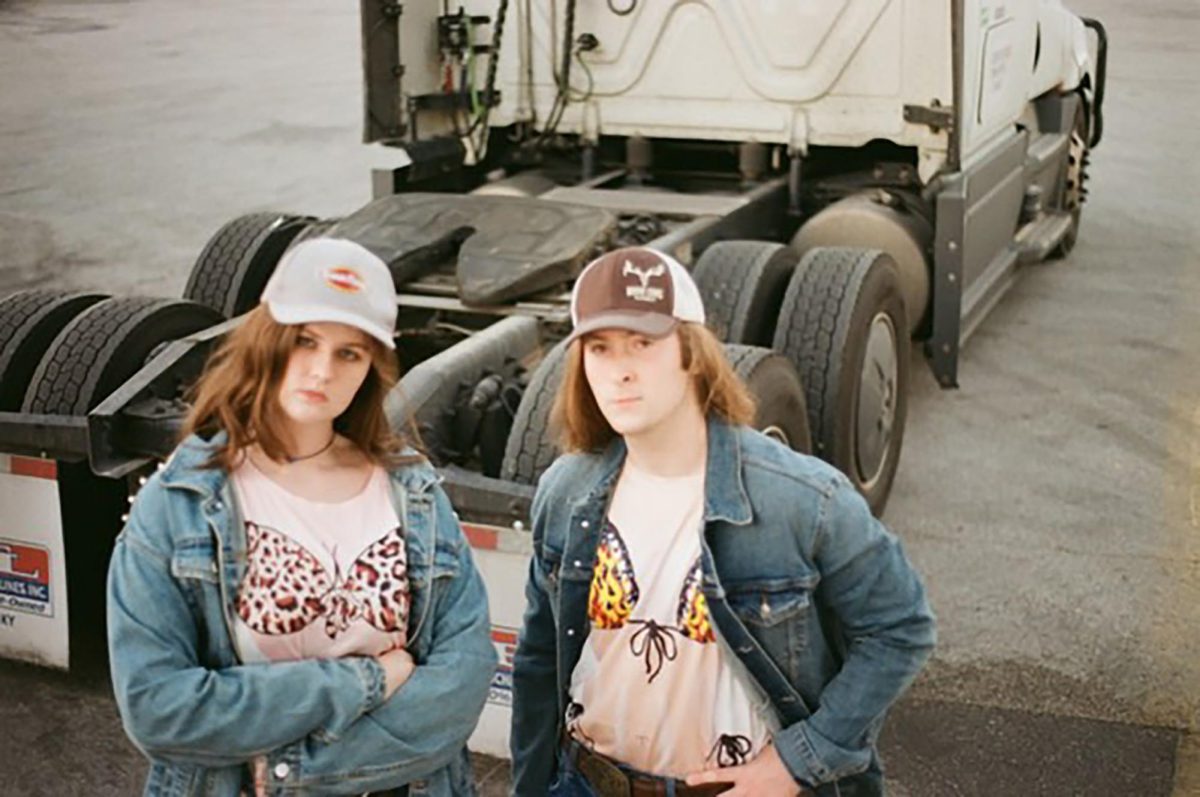 Bikini Truck Stop drummer Bella Sera (Left) and guitarist/bassist Garrett Stacha (Right) film promotional material for their upcoming single release, Thursday, Oct. 10, 2024, at the New Braunfels Travel Center. Photo courtesy of Eric Wendt.