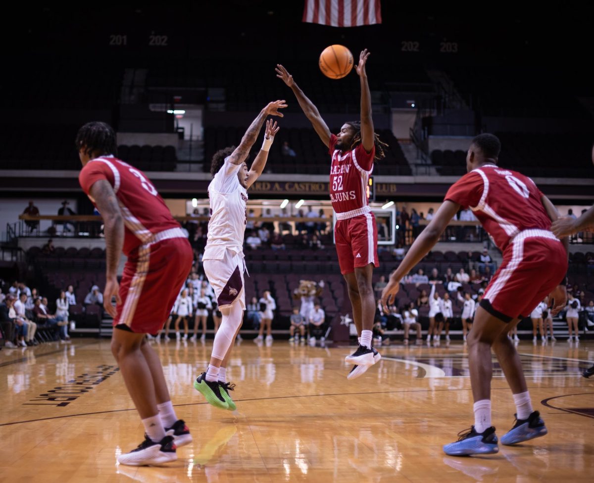 Texas State men’s basketball player’s shot gets blocked by opposing team at the game on Jan 30.