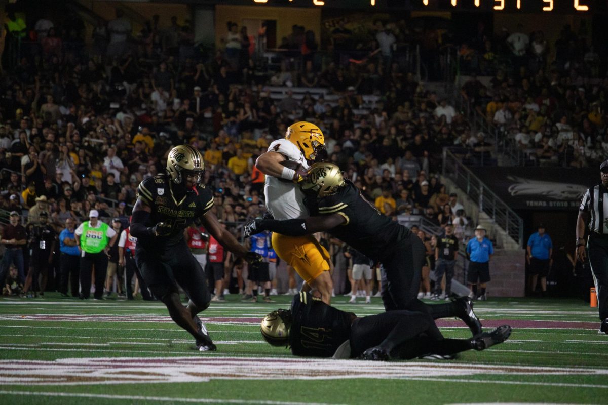 Texas State junior defensive end Deven Wright (11) sacks Arizona State's quarterback,Thursday, Sept. 12, 2024, at UFCU Stadium.