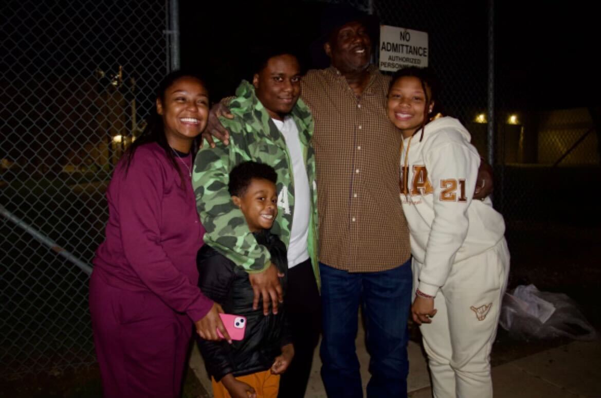 DeVonte Amerson and his family stand outside the Hays County Jail the night he is released on bond on Dec. 12, 2023.