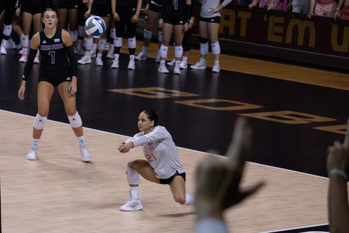 Texas State senior Libero Alyssa Ortega (21) bumps the ball during the Arkansas State. Friday, Oct. 18, 2024 at Strahan Arena.