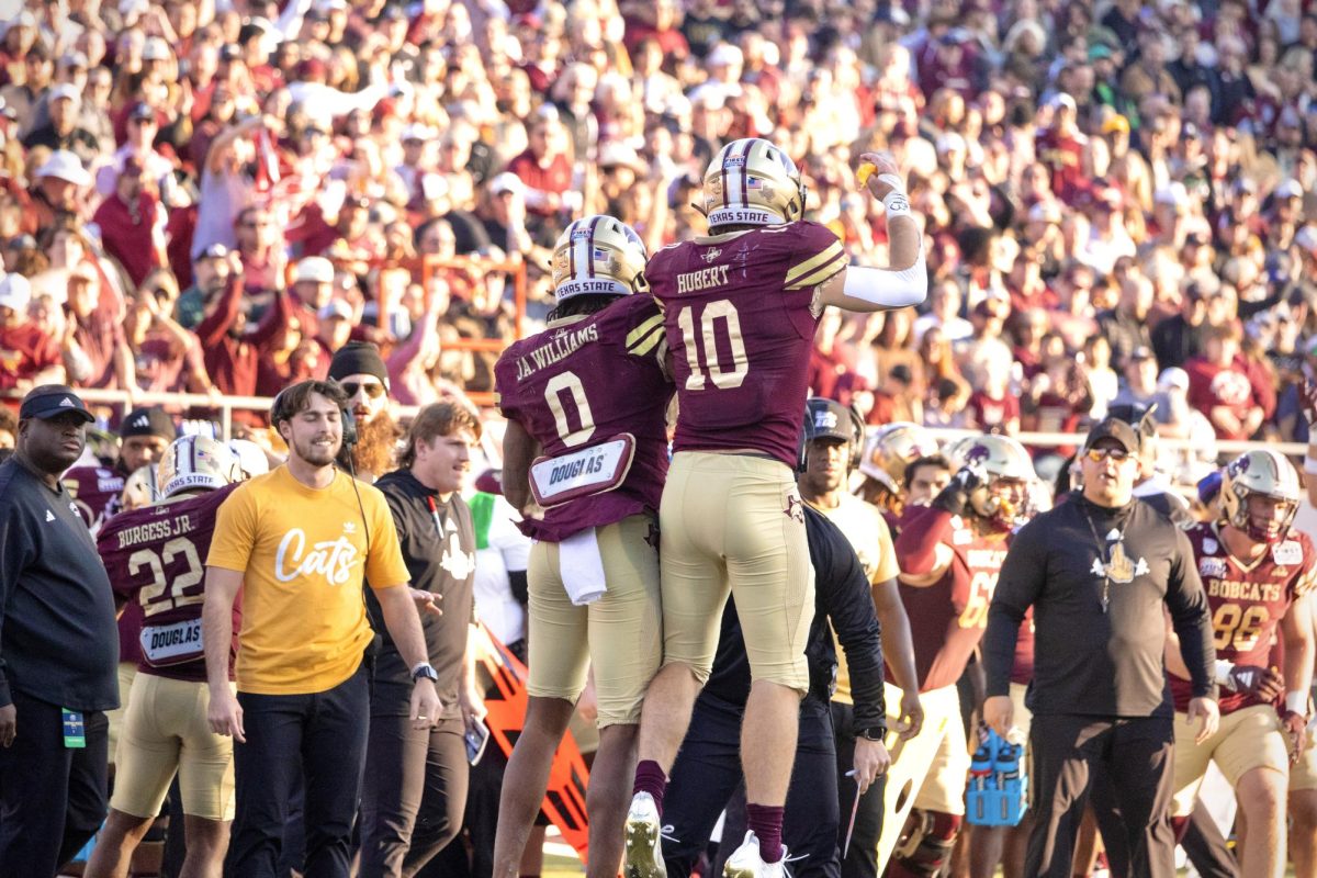 Texas State senior wide receiver Jaden Williams (0) and senior wide receiver Joey Hobert (10) celebrate a touchdown during the SERVPRO First Responder Bowl game against North Texas, Friday, Jan. 3, 2025, at Gerald J. Ford Stadium.