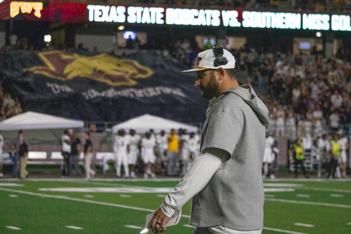 Texas State football head coach G.J. Kinne walks onto the field before the Bobcat's game against the Golden Eagles. Saturday, Nov. 17, 2024 at UFCU Stadium.