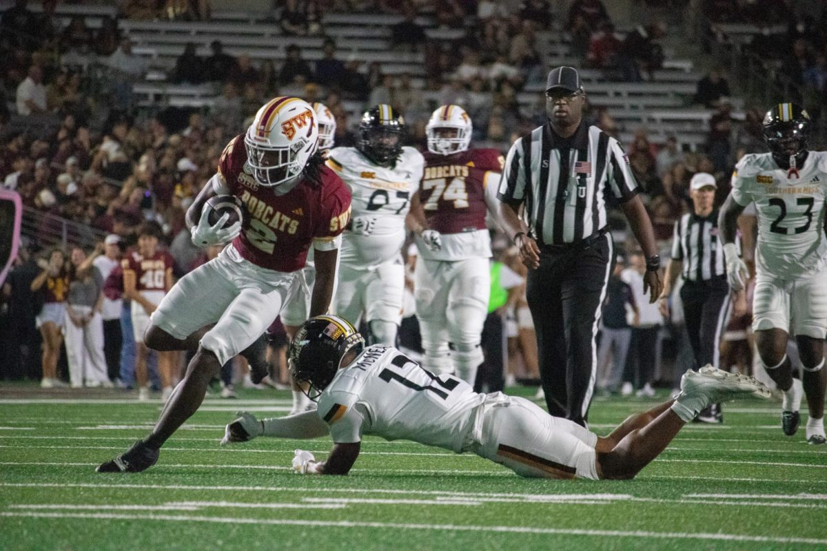 Texas State junior wide receiver Kole Wilson (2) runs past his Golden Eagle defenders. Saturday, Nov. 17, 2024 at UFCU Stadium.