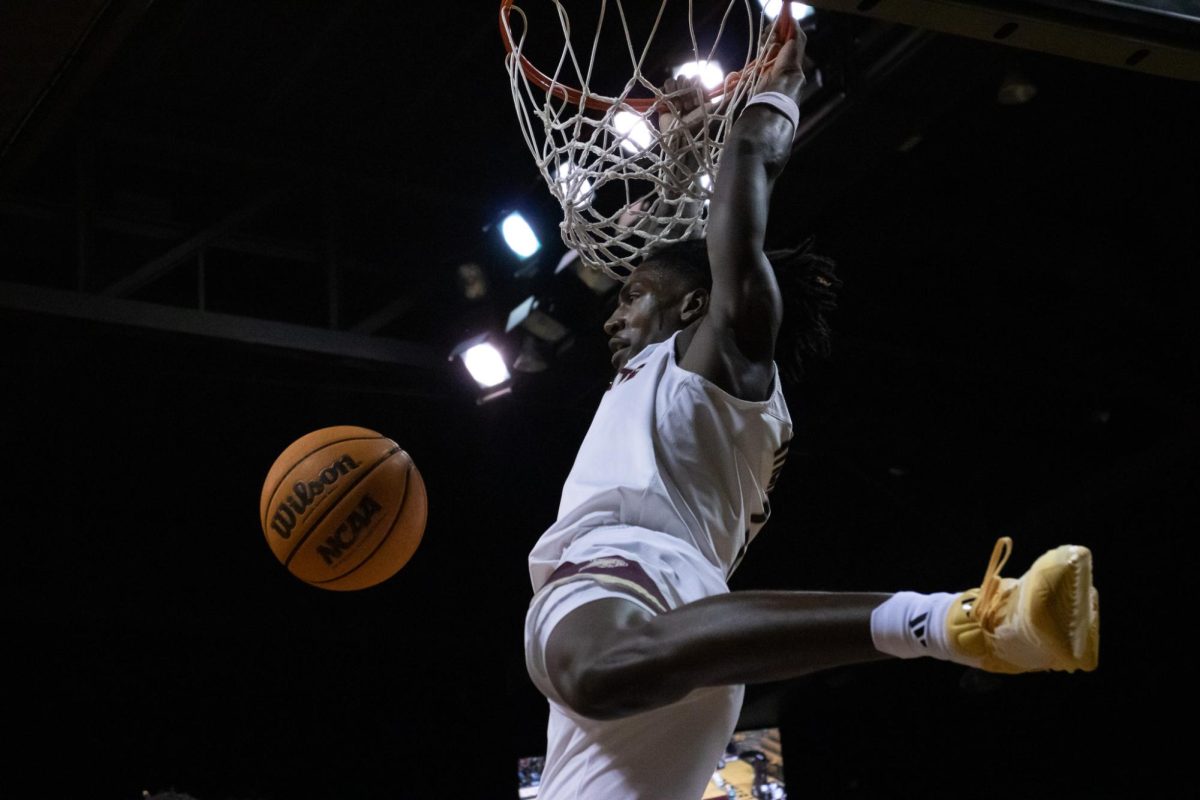 Texas State graduate student forward Tyrel Morgan (1) dunks the ball into the basket during the game against Eastern Michigan. Monday, Nov. 11, 2024 at Strahan Arena.