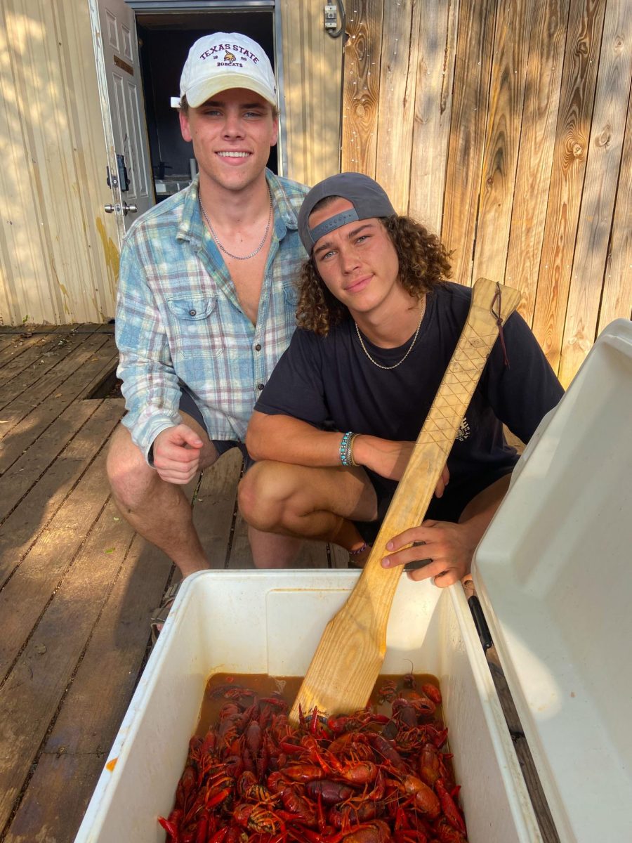 Bobcat Crawfish Co. founders Riley Mella (Left) and Jagger Lechler (Right) stir crawfish, Tuesday, Feb. 27, 2024, in San Marcos. Photo courtesy of Riley Mella.