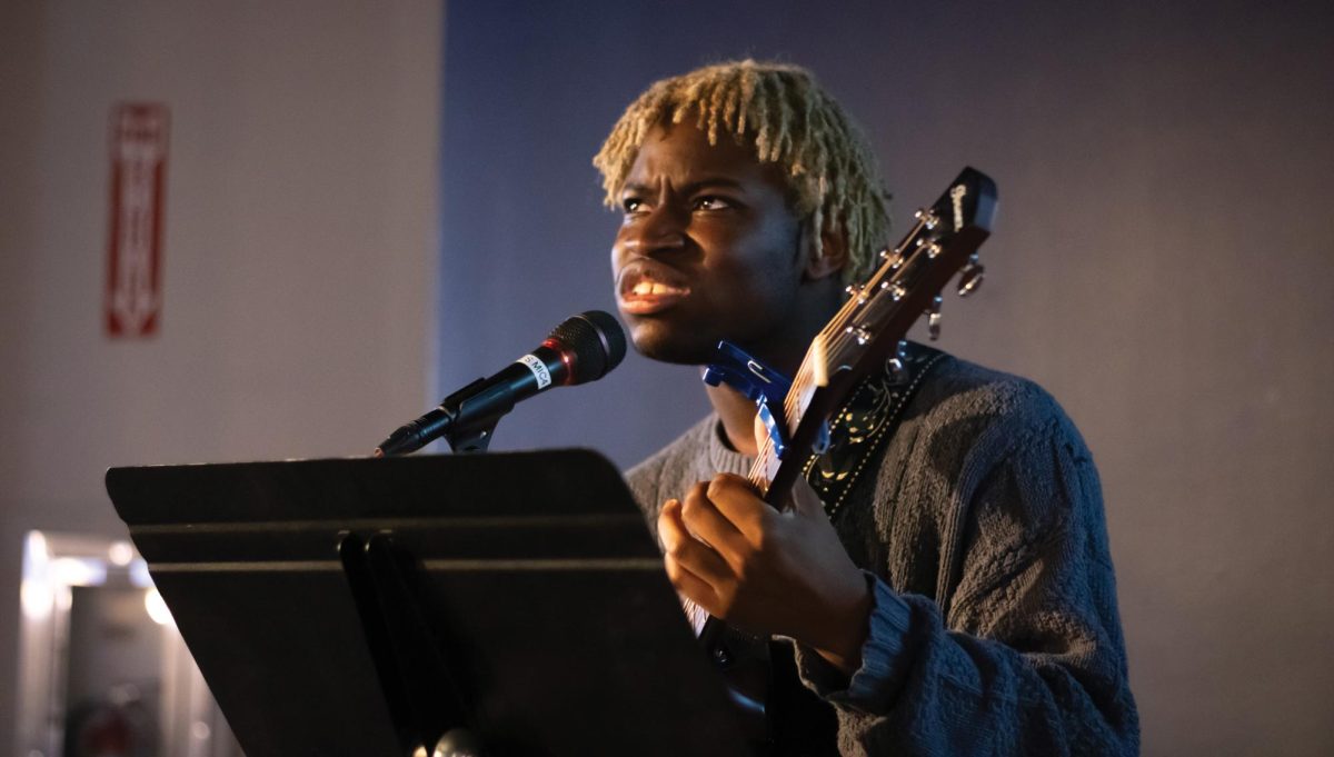 Texas State theater performance and production junior Dietrich Calhoun plays original music during George's Open Mic Night, Wednesday, Jan. 22, 2025, at the LBJ Student Center. 