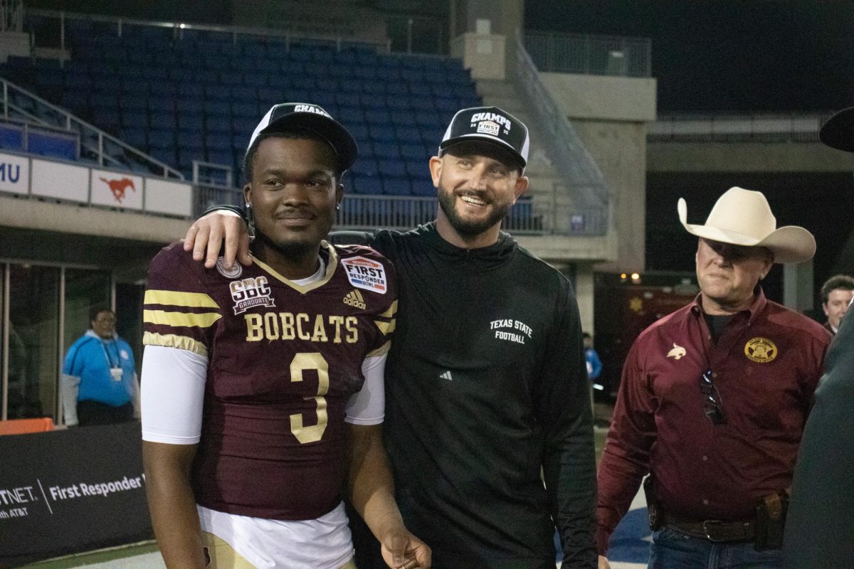 Texas State football head coach G.J. Kinne and senior quarterback Jordan McCloud (3) celebrate defeating North Texas at the Servpro First Responders Bowl. Friday, Jan. 3, 2024 at Gerald J. Ford Stadium.